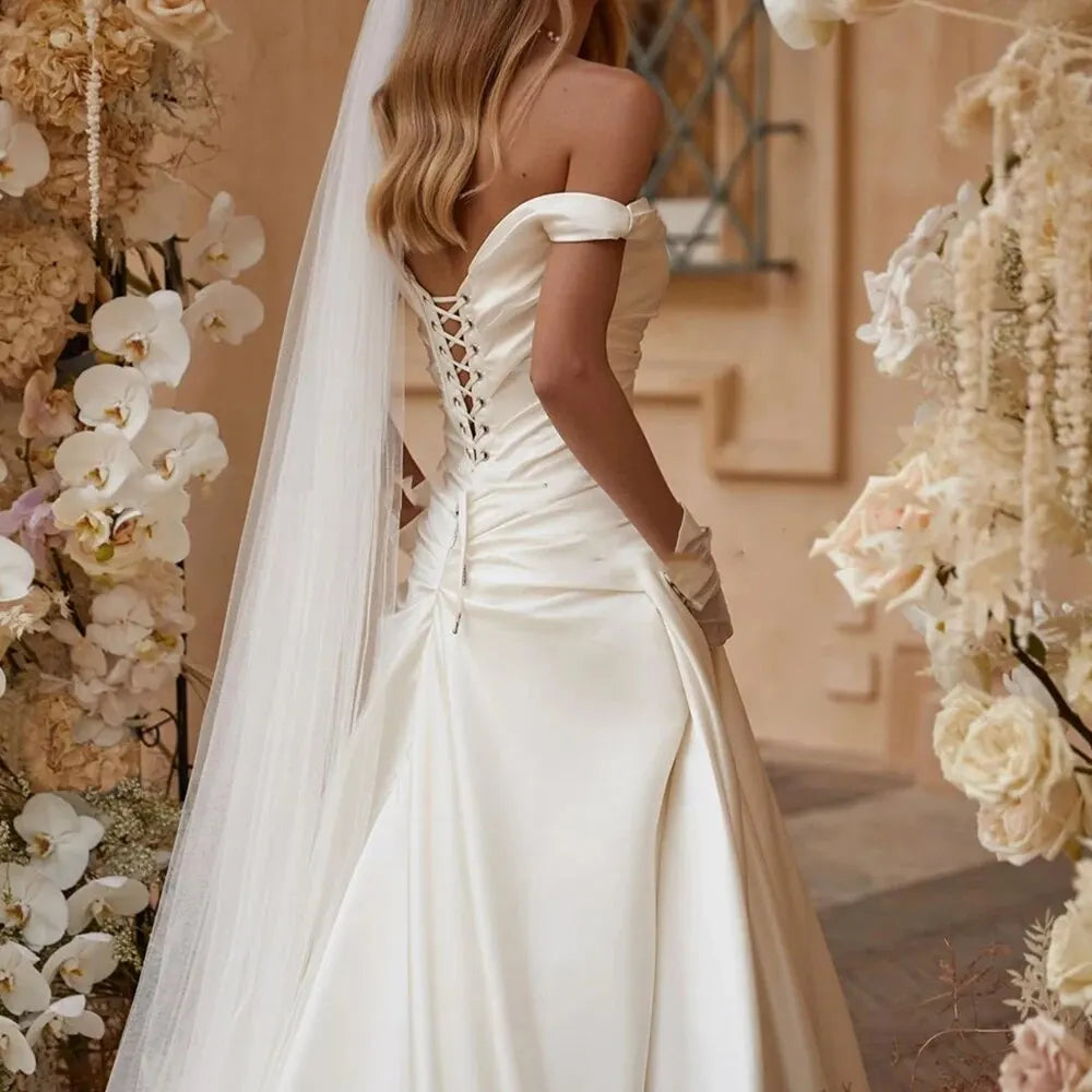 Gaun pengantin duyung pepejal seksi dari bahu berlipat gaun pengantin backless buatan adat yang dibuat untuk mengukur elegan putih