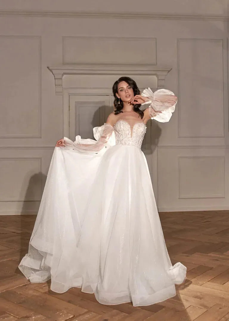 Classic A-Line Bridal Gown with Long Sleeves, Nude Neckline, Lace Embellishments, and Natural Waistline Satin