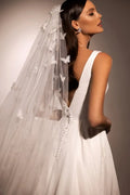 Sophisticated A-Line Wedding Gown with Deep Neckline, Sleeveless Design, and Button Embellishments Satin