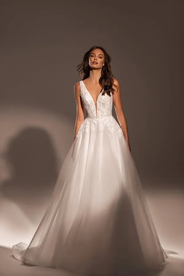 Graceful A-Line Wedding Dress with V-Neckline, Sleeveless Design, and Lace Embellishments Satin
