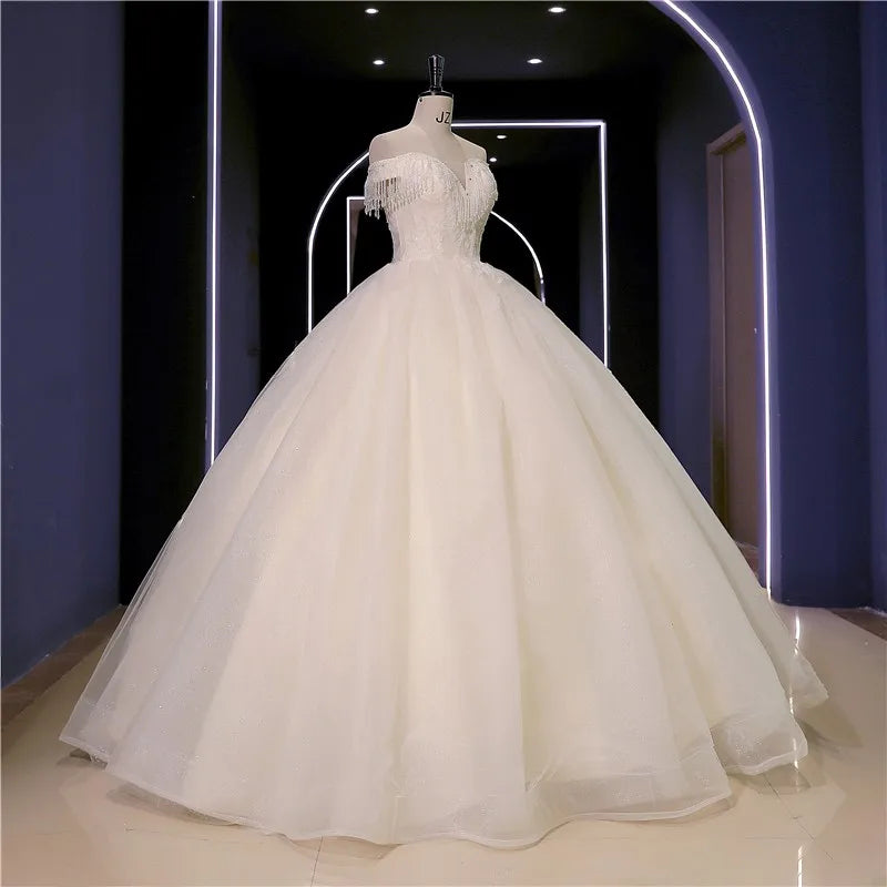 Abiti da sposa Nuovo perline di lusso Vestido de Noiva Abito da ballo fotografico da spalla personalizza Robe de Mariee