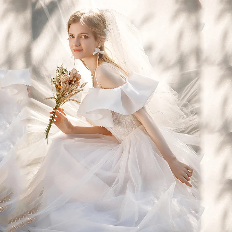 Robe de mariée française de luxe en Satin blanc, avec traîne de chapelle, avec nœud, élégante, Sexy, Slim, manches bouffantes, robe de soirée pour femmes