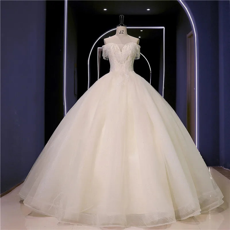 Abiti da sposa Nuovo perline di lusso Vestido de Noiva Abito da ballo fotografico da spalla personalizza Robe de Mariee