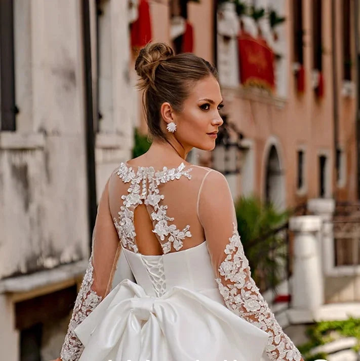 Vestido de novia de satén elegante para novia, manga larga transparente, cuello redondo, apliques en la espalda, vestido de novia con corsé con lazo grande, diseño de línea A