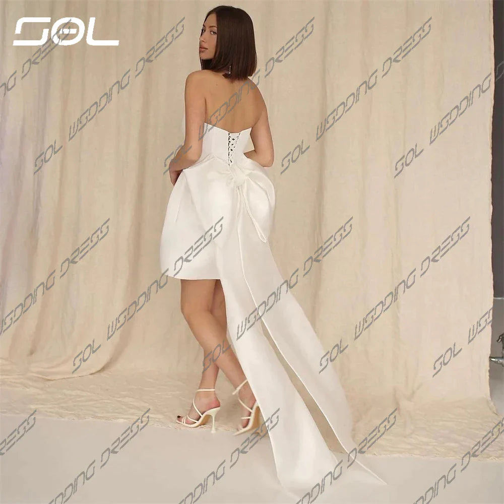 Mini strapless sederhana di atas lutut gaun pengantin pendek dengan busur besar yang dapat dilepas elegan kembali ke gaun pengantin jubah de mariee