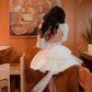 שמלות מסיבות חתונה קצרות של טול שרוולים ארוכים גבוהים שמלות כלות מיני עם קשת גדולה שמלת כלות ללא גב אחרי החתונה