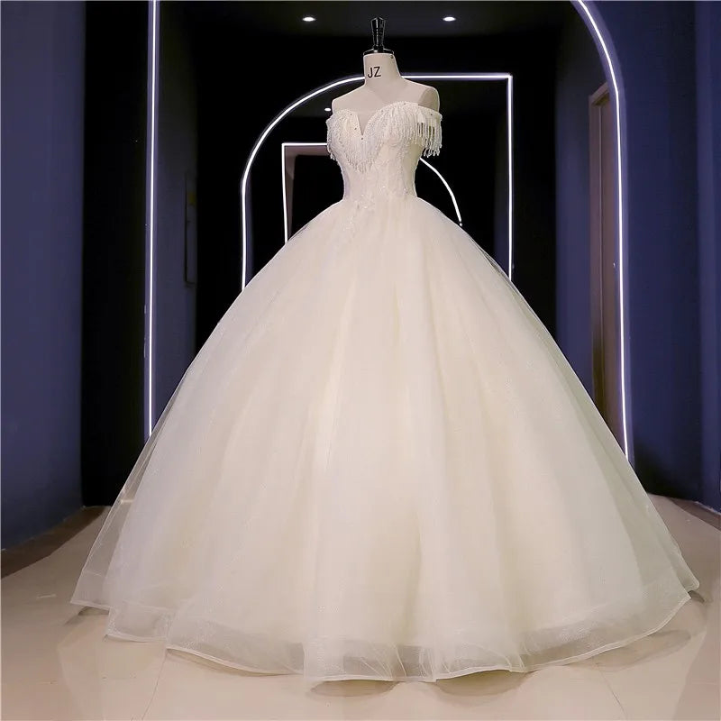 Abiti da sposa Nuovo perline di lusso Vestido de Noiva Abito da ballo fotografico da spalla personalizza Robe de Mariee