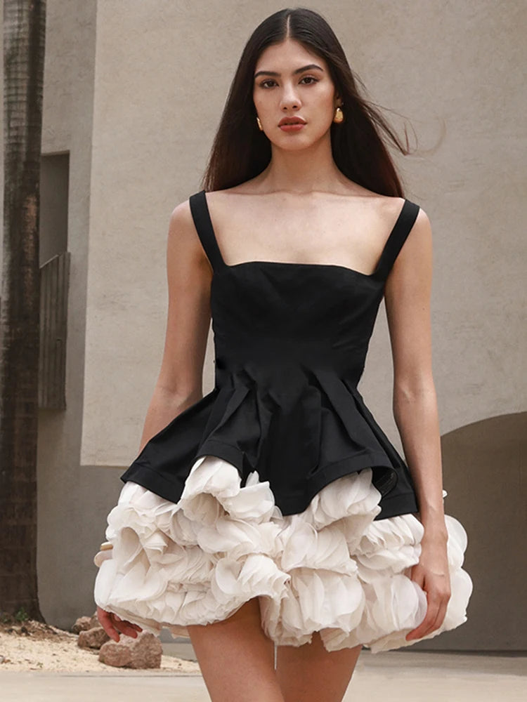 Elegant Black Mini Dress with Peplum and White Ruffle Accents for Upscale Casual Gatherings