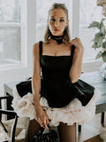 Elegant Black Mini Dress with Peplum and White Ruffle Accents for Upscale Casual Gatherings